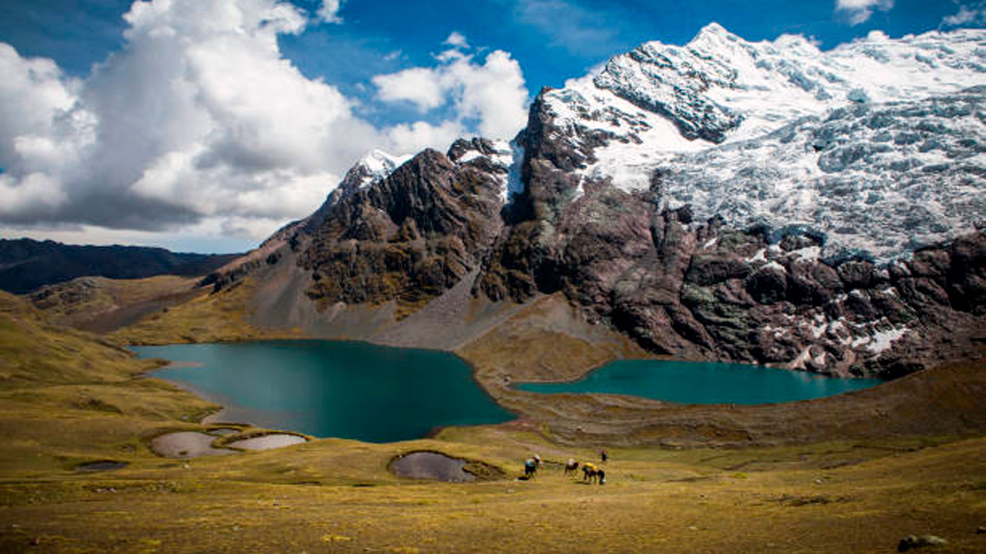 7 Lakes of Ausangate turquoise glacial lagoons and snowy mountain peak in Peru