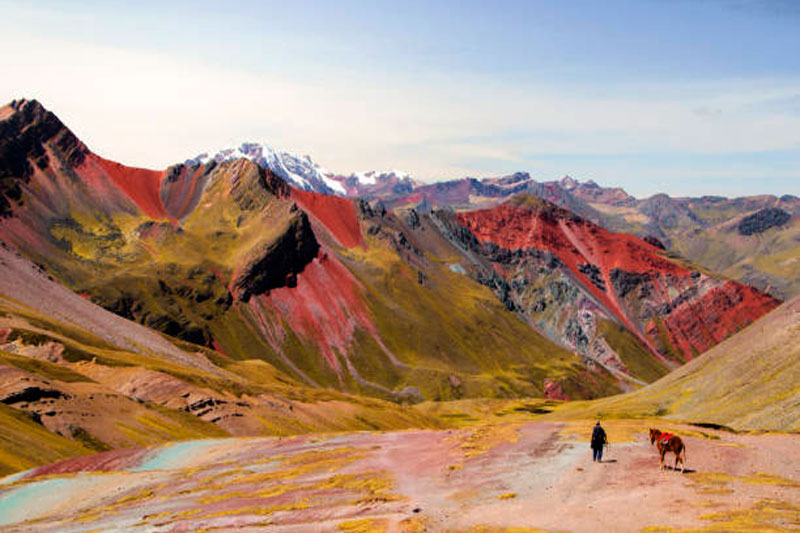 Palcoyo Rainbow Mountain alternative scenic route with three colorful ranges and stone forest in Peru